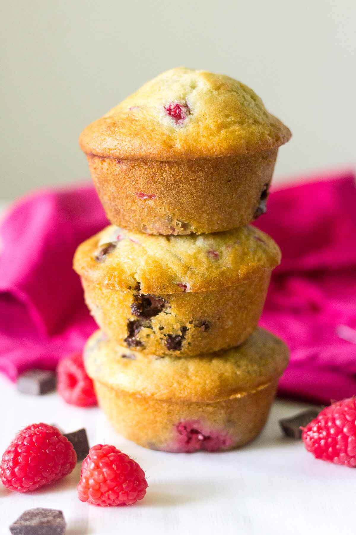 Soft and buttery muffins packed full of yummy ingredients! These Raspberry Chocolate Chunk Muffins will make your next Monday mornings the best yet. The melty chocolate oozes with each bite and the raspberries burst with flavor.