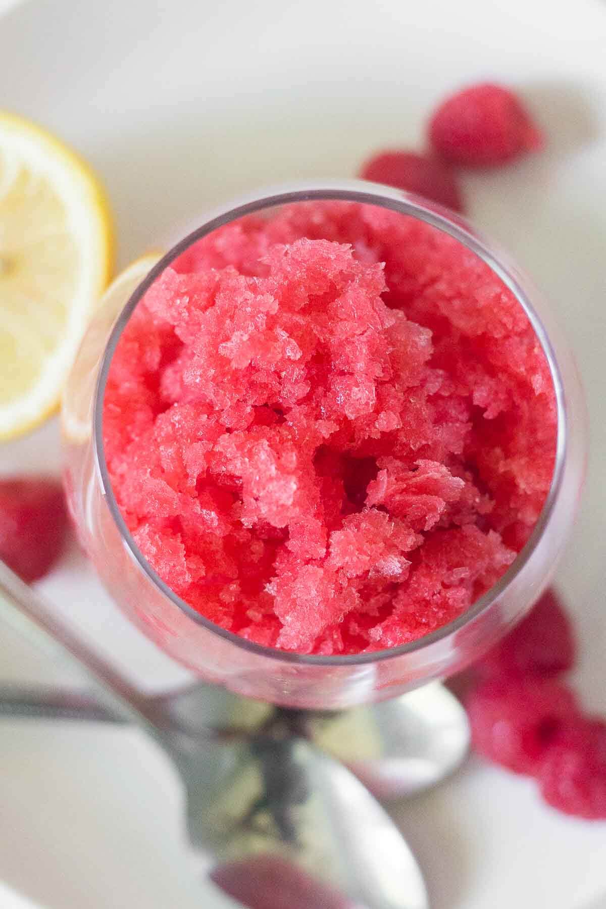 aerial view of a glass of raspberry lemonade granita