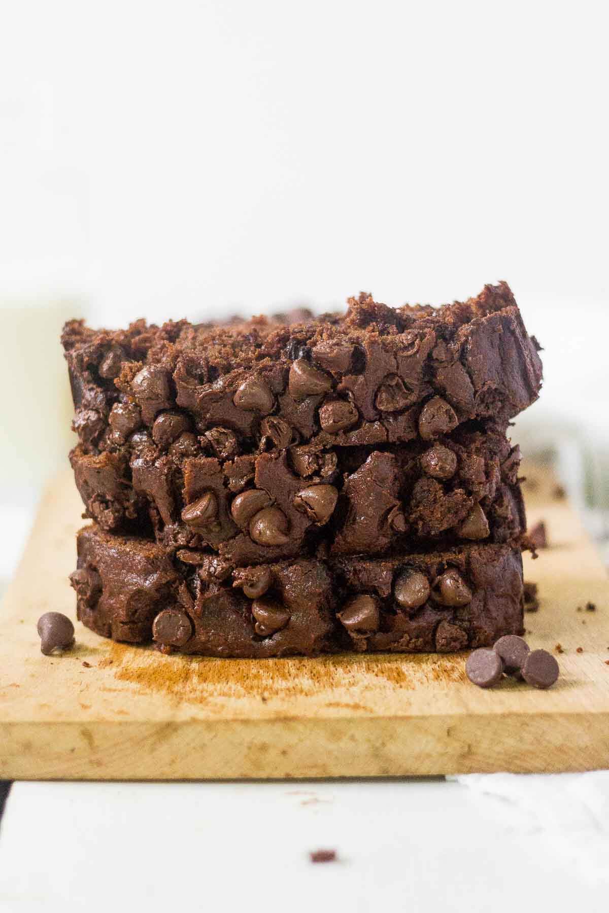 three pieces of healthy chocolate chip banana bread stacked 