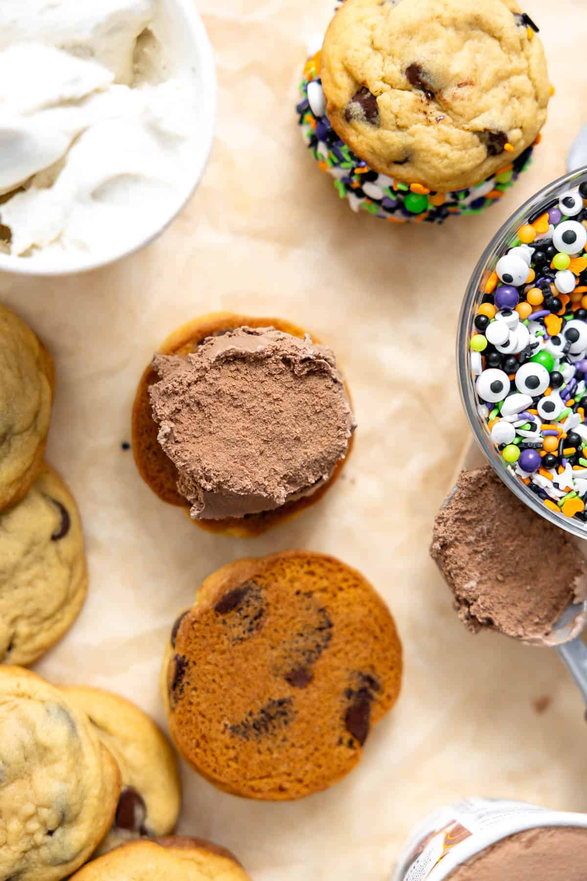 adding ice cream to a cookie sandwich.