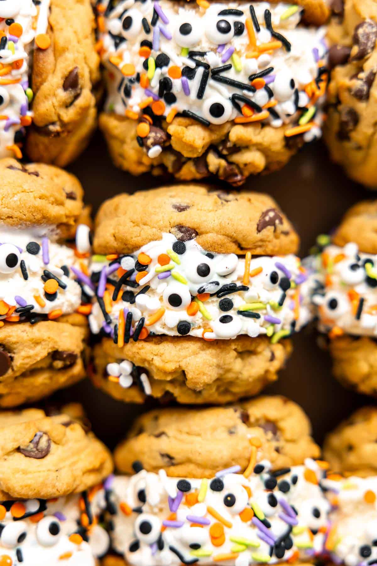 halloween sprinkles decorating an ice cream cookie sandwich.