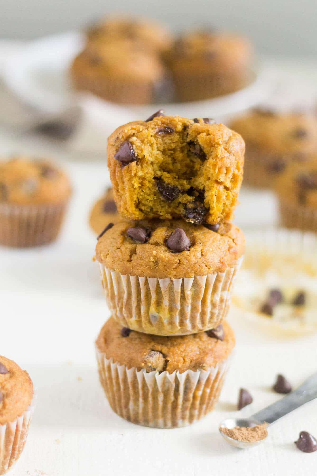 3 gluten free pumpkin chocolate chip muffins stacked on top of each other