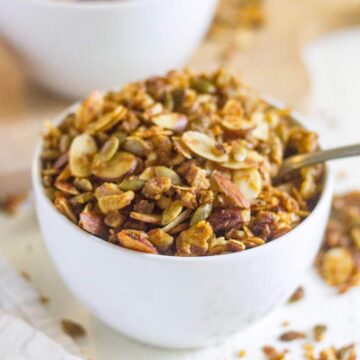 Grain free pumpkin granola is your next easy, gluten free and paleo breakfast for fall! Made with nuts, seeds, coconut and pumpkin spice, this healthy breakfast recipe will start your day with a crunch.