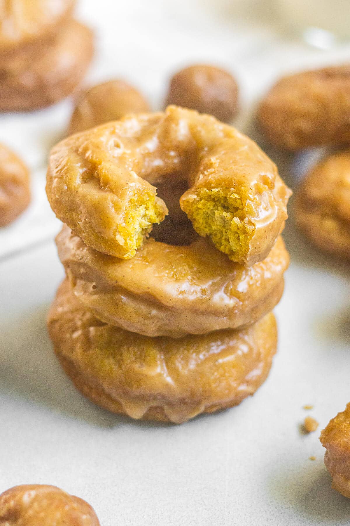 Get ready for these homemade old fashioned pumpkin donuts! They're cake like, filled with pumpkin spice and melt in your mouth. The sour cream and pumpkin puree make for a tasty breakfast recipe. Read more to learn how to make old fashioned pumpkin donuts!