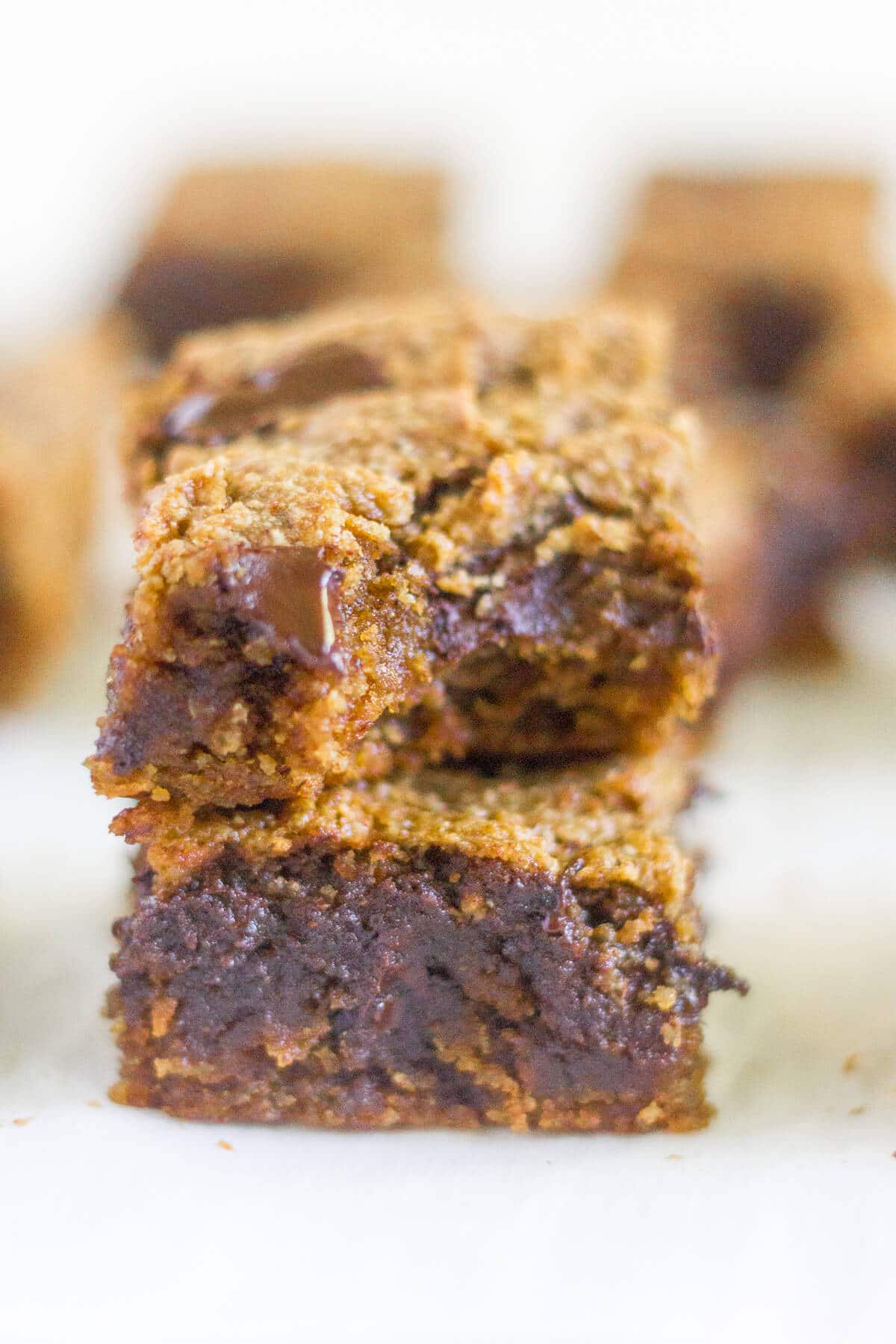 Paleo Pumpkin Chocolate Chunk Blondies are a healthier alternative to all your pumpkin desserts! These paleo blondies are thick and chewy and filled with pumpkin and extra large chocolate chunks.