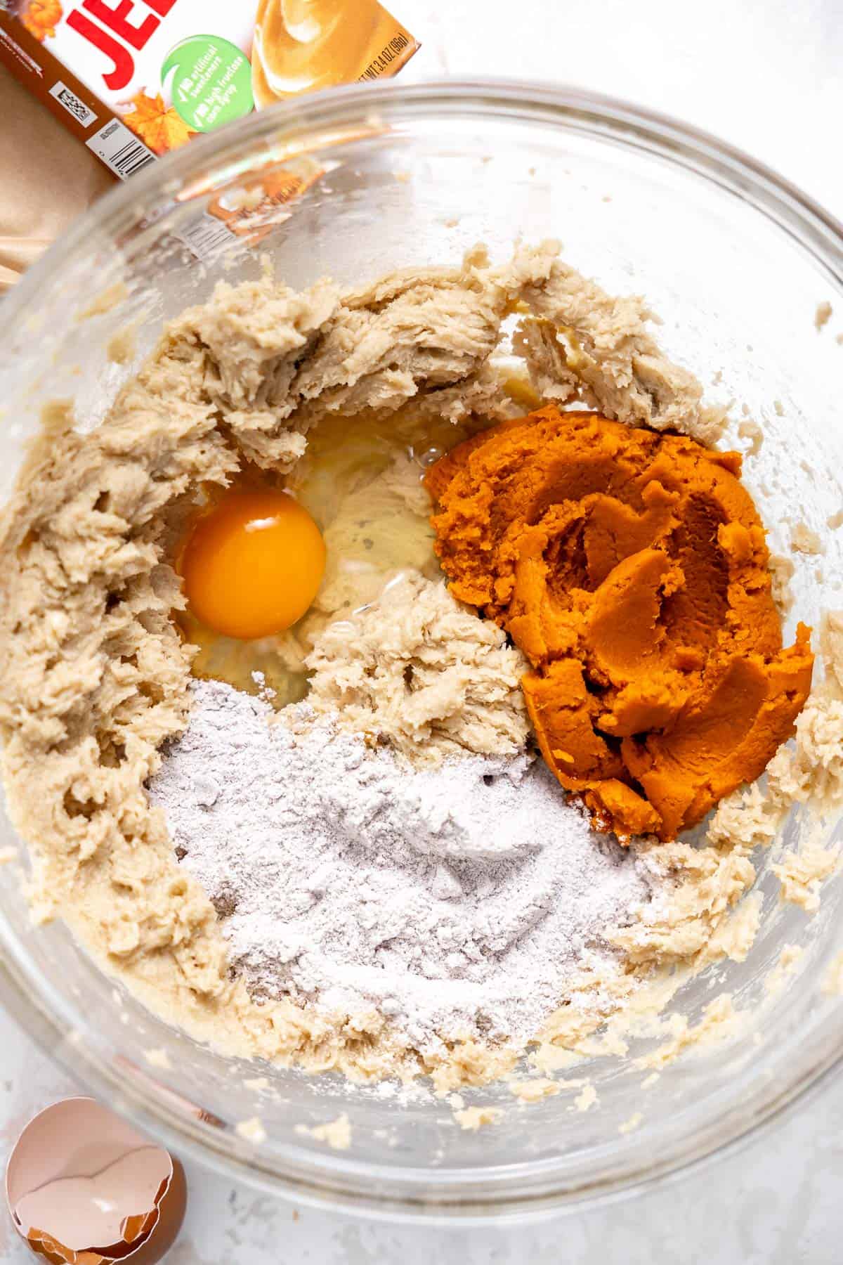 we ingredients for pumpkin pudding cookies in a mixing bowl.