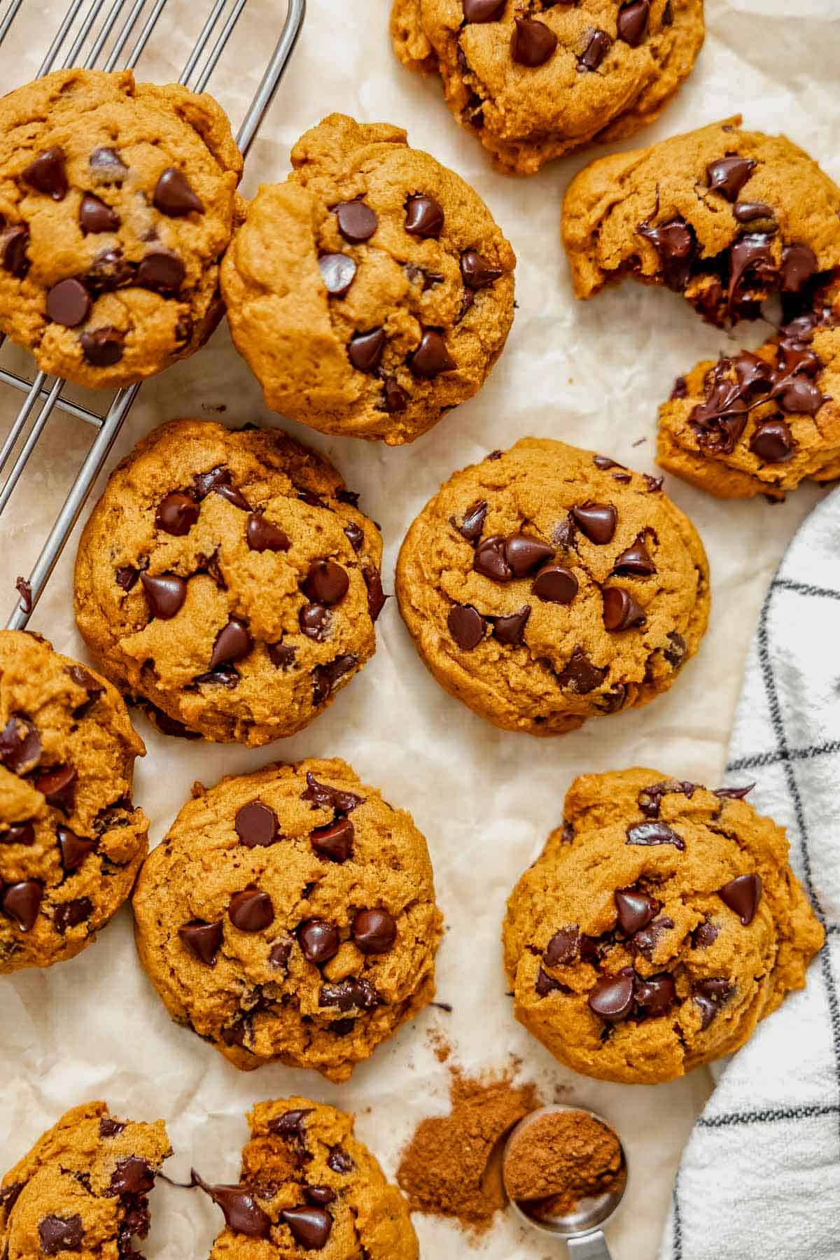 pumpkin pudding cookies on a sheet of parchment paper.