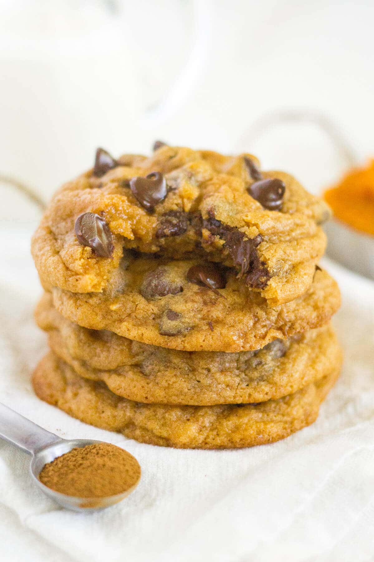 stack of three pumpkin chocolate chip cookies