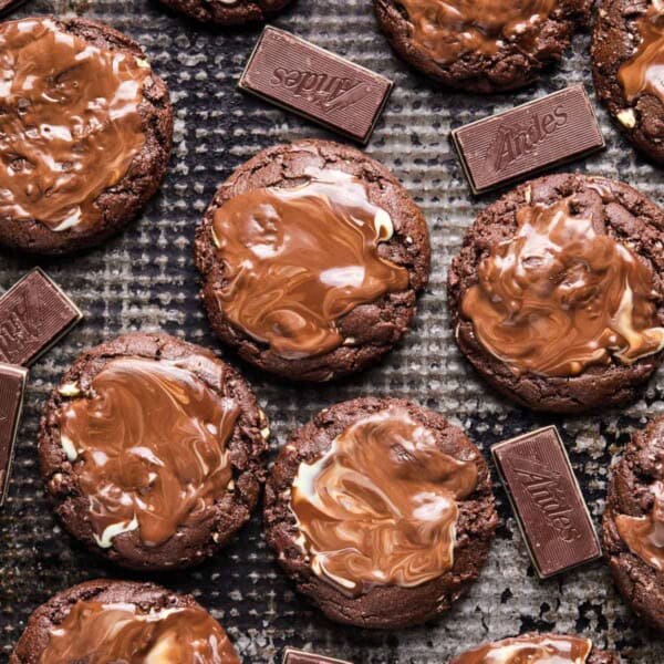 a batch of andes mint cookies cooling on a wire rack.