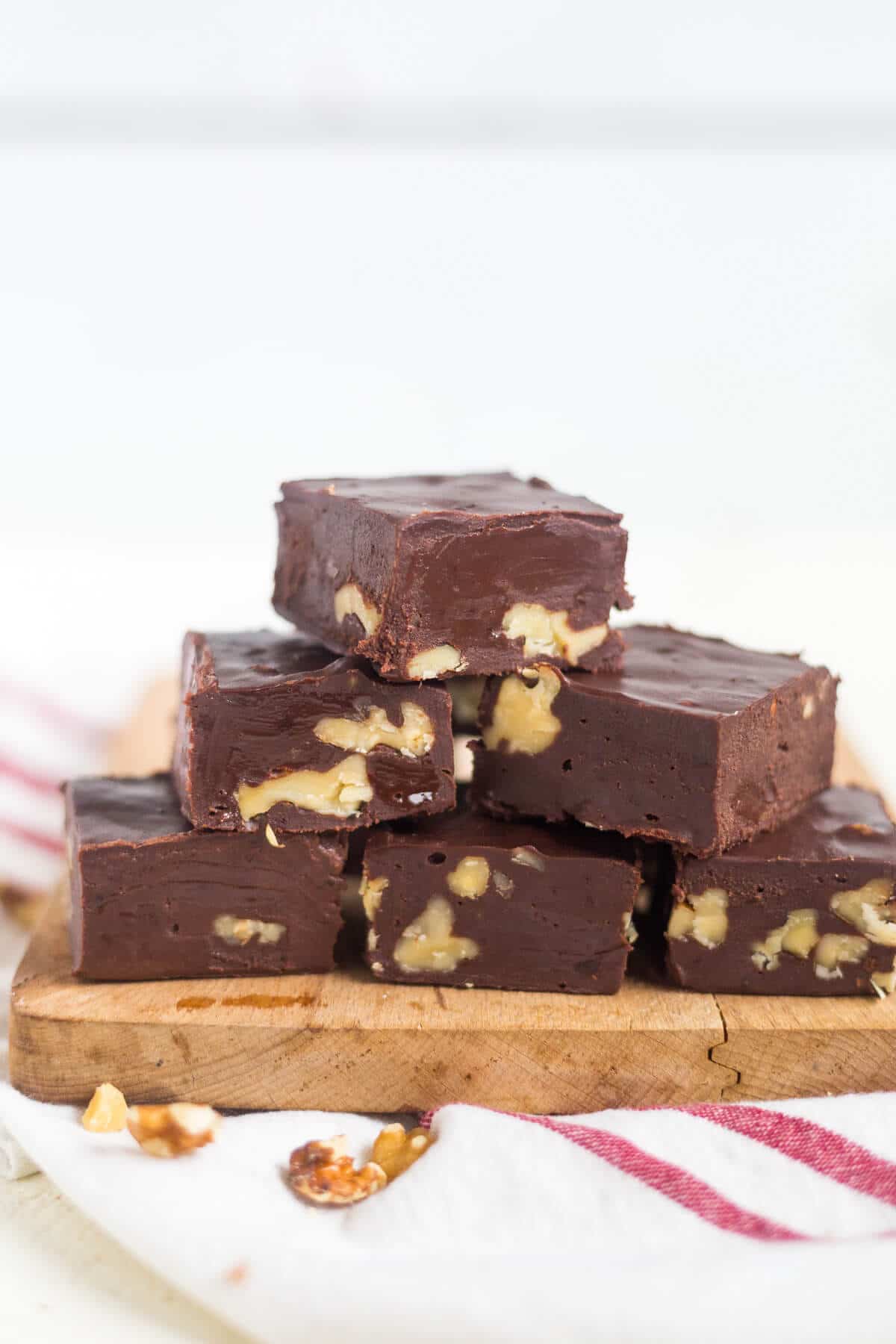 This easy paleo fudge comes together in a few minutes! It's made with coconut oil, coconut milk, honey and cocoa powder so it's dairy free, grain free and refined sugar free, making them a delicious paleo dessert!