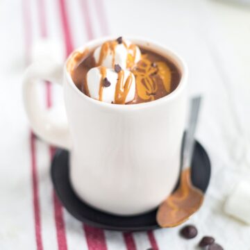 This healthy peanut butter hot chocolate is a rich and creamy (but healthy!) holiday drink. It comes together in minutes and it's filled with good-for-you ingredients. Not to mention it's dairy free, gluten free and refined sugar free!