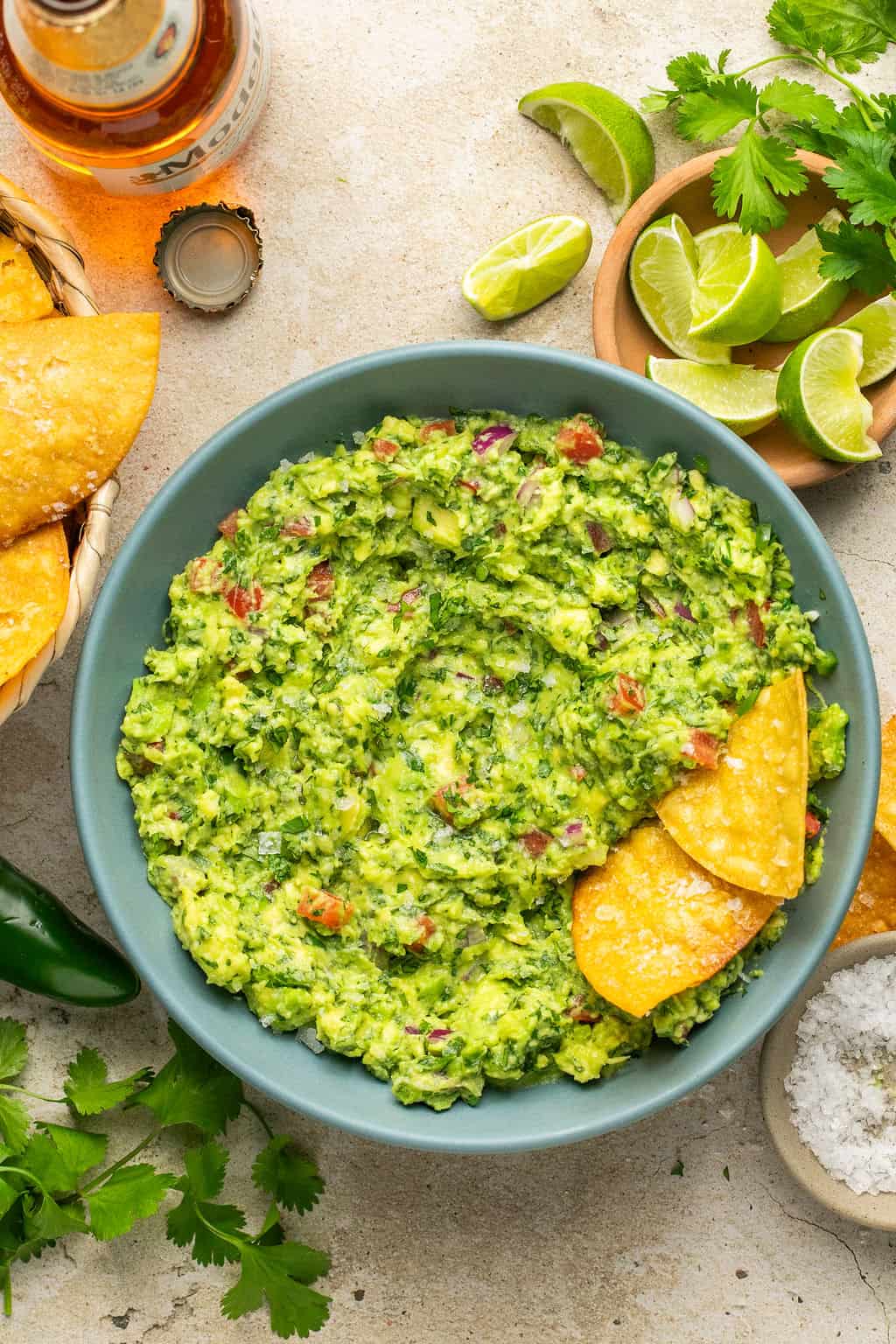 guacamole in a bowl with homemade tortilla chips