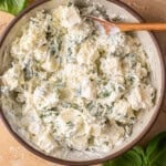 sour cream, basil, and mozzarella in a mixing bowl