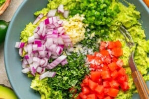 guacamole ingredients in a bowl before mixing