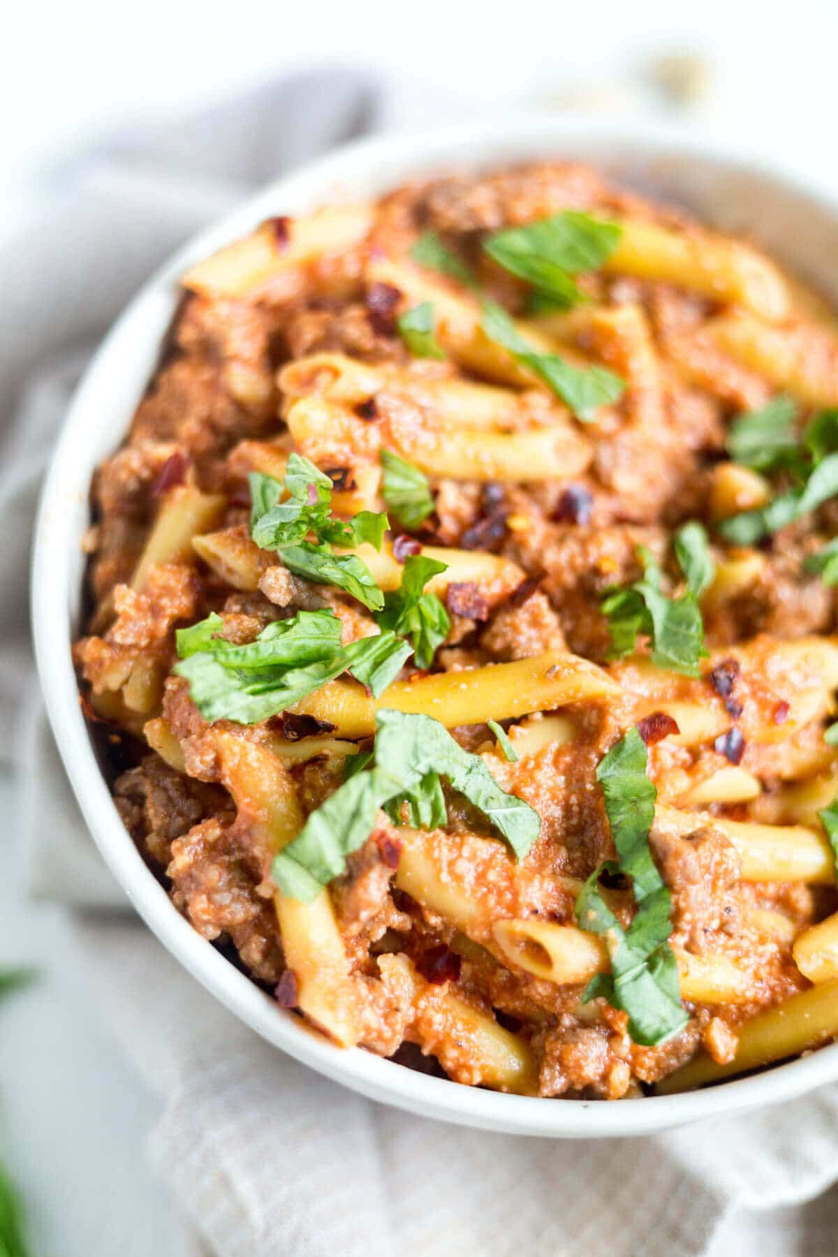 penne all arrabbiata topped with fresh basil