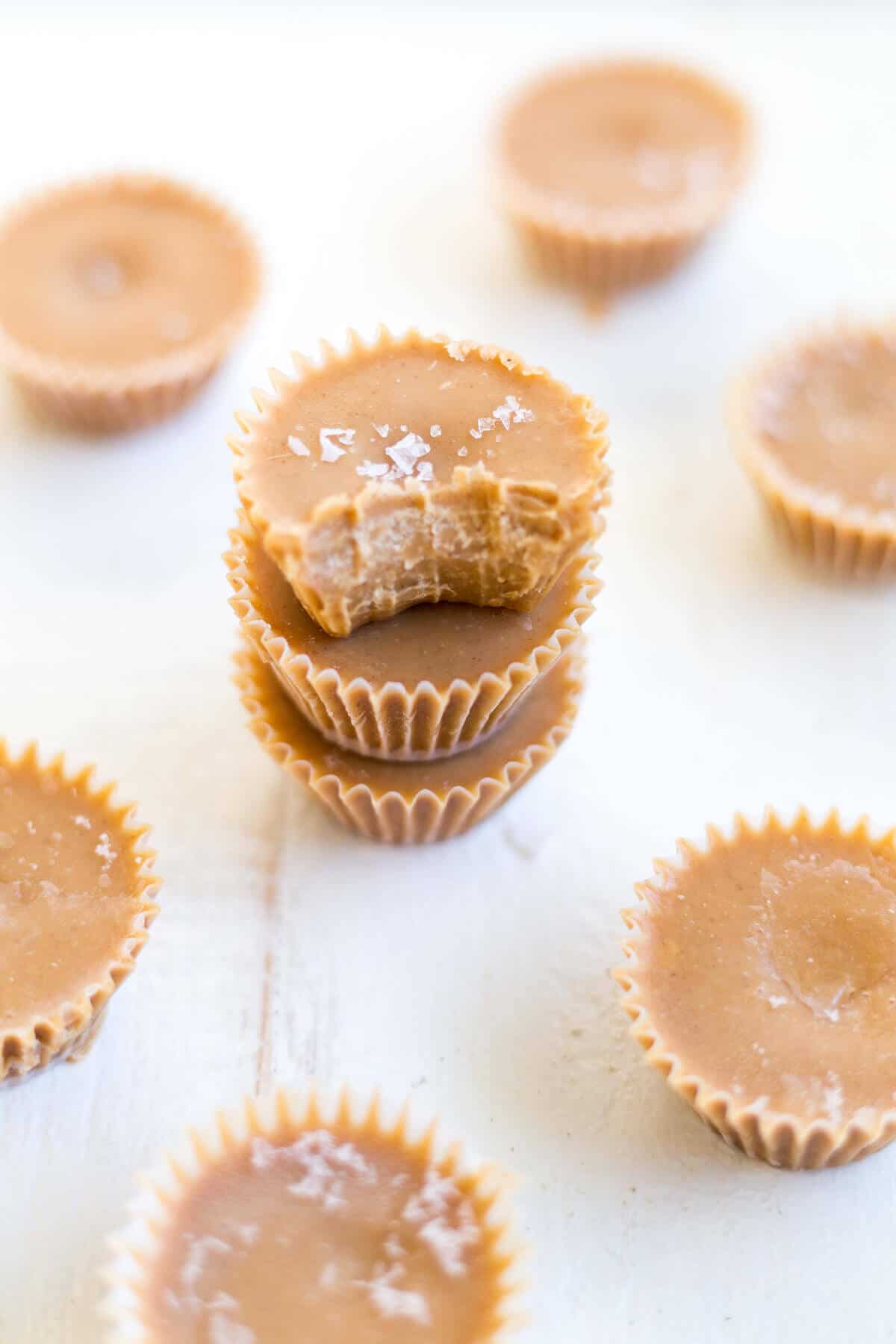 three peanut butter fat bombs stacked on top of each other