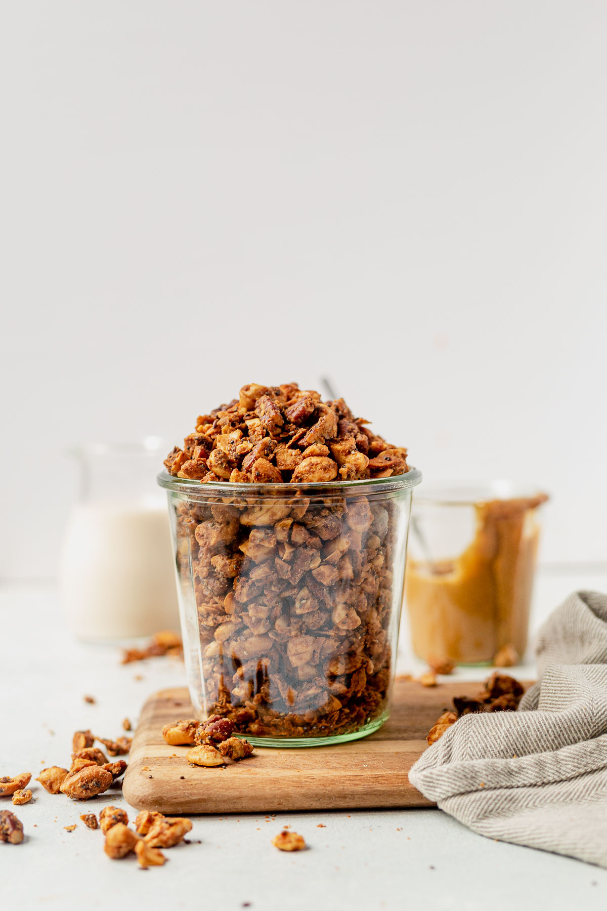 grain free granola in a glass weck jar on a cutting board