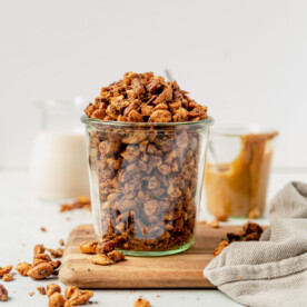 grain free granola overflowing out of a glass jar