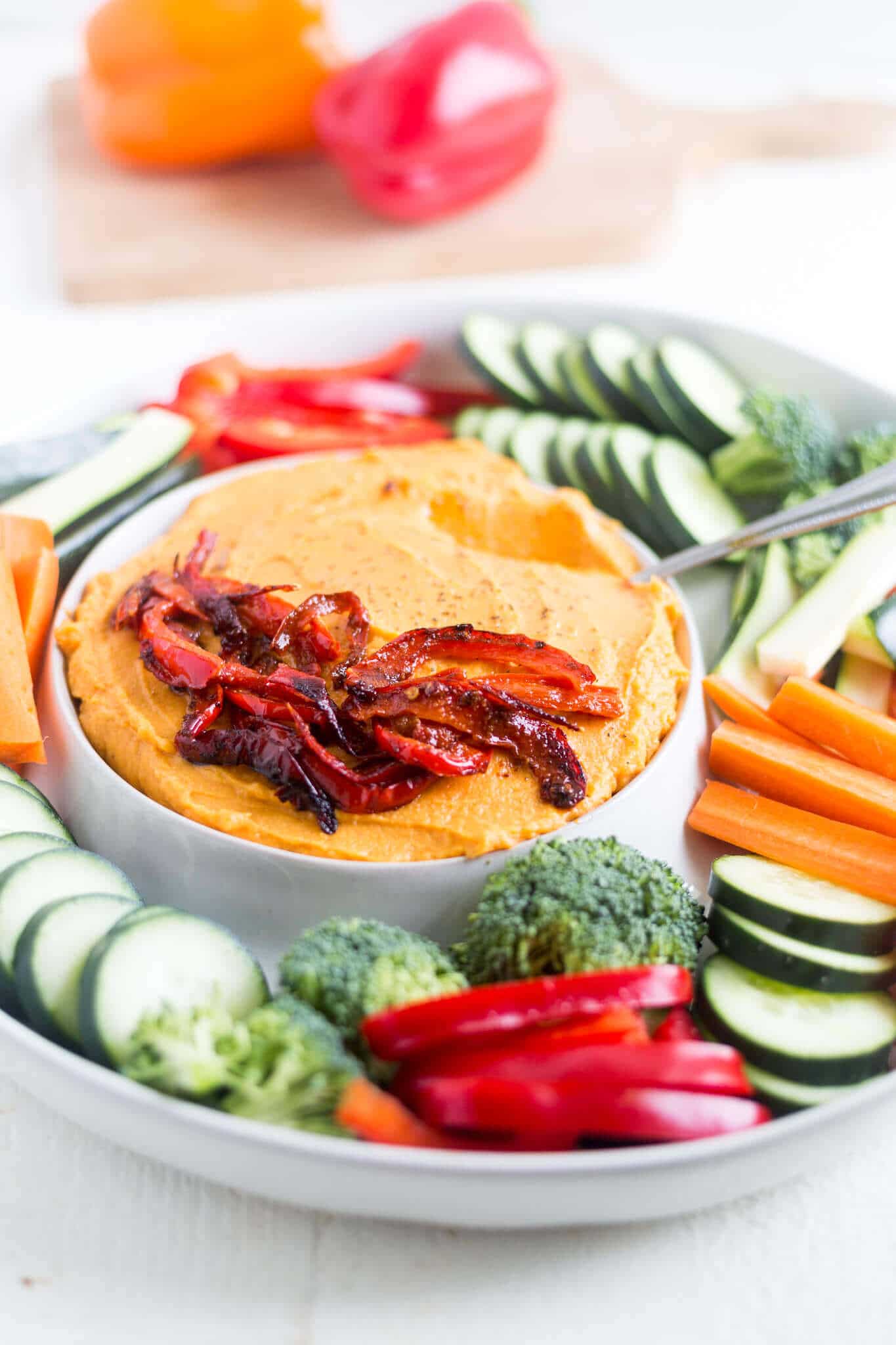 sweet potato hummus on a serving dish with fresh veggies