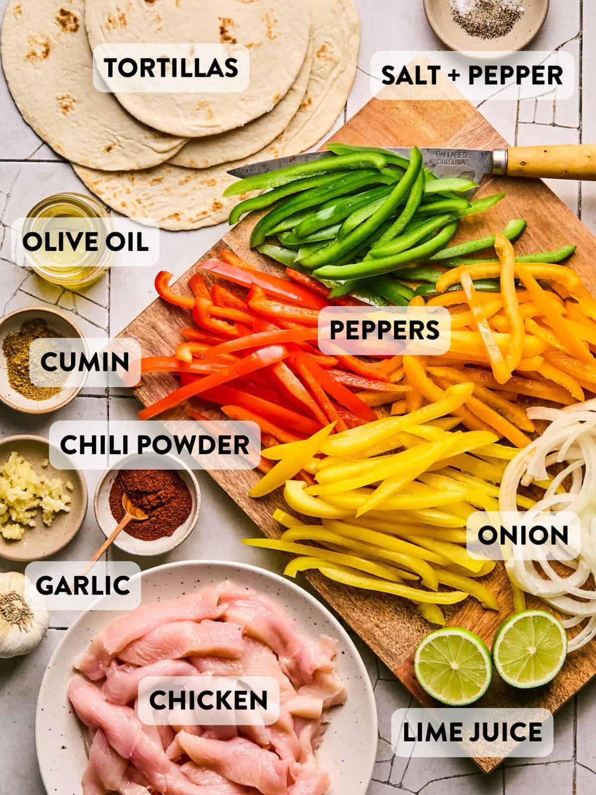 ingredients for sheet pan chicken fajitas on a counter.