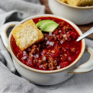 beanless chili recipe topped with red onion and avocado