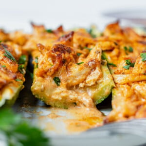 buffalo chicken zucchini boat cut in half to see the creamy inside