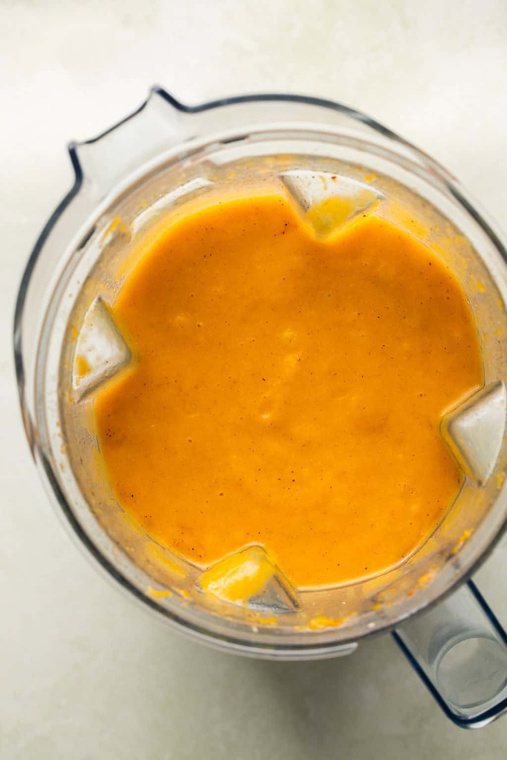 butternut squash soup blended in a stand blender until smooth and creamy.