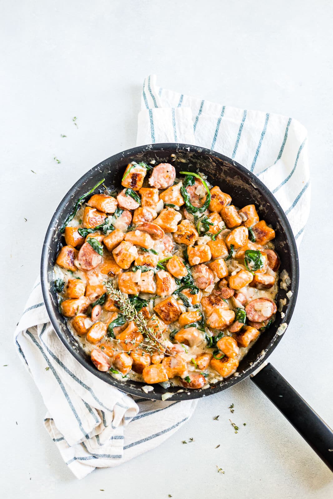 sweet potato gnocchi cooked in a cream sauce with spinach