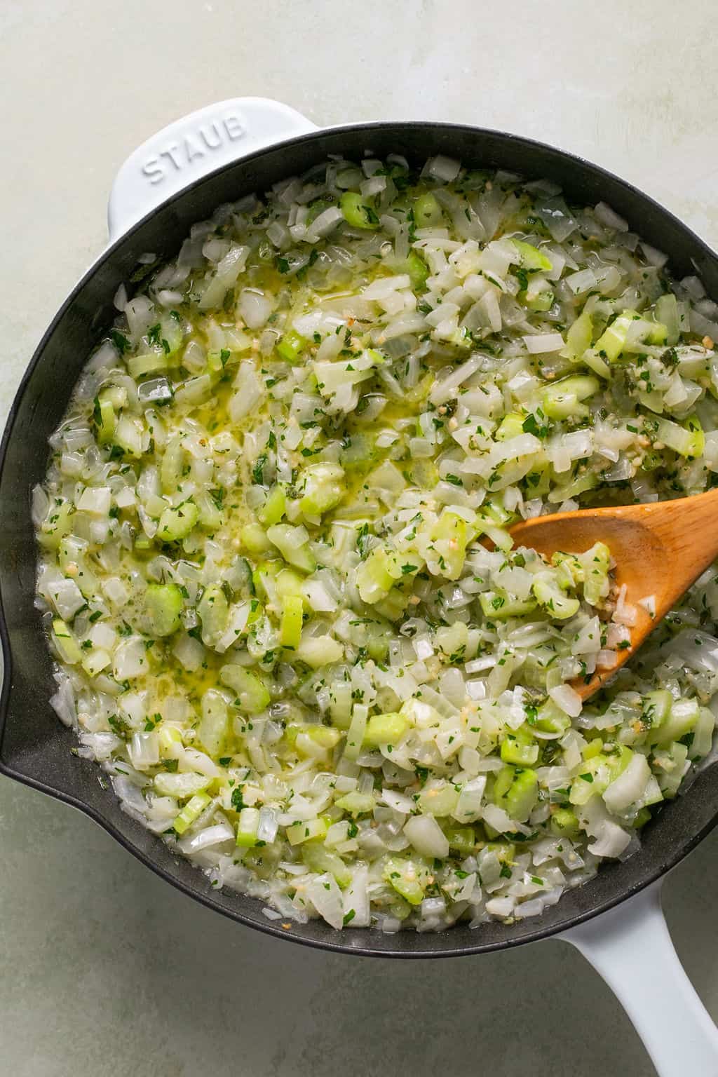 cooked onion, celery, garlic, and herbs in a skillet.