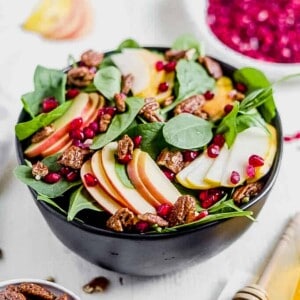 pear salad with goat cheese in a black serving bowl