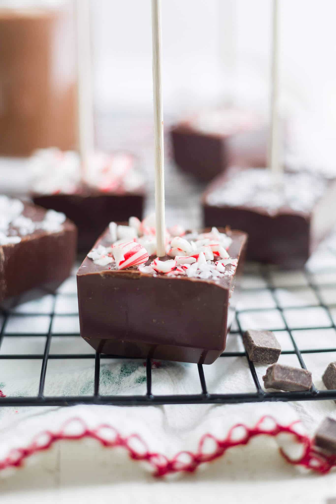 diy hot chocolate sticks topped with crushed peppemint cooling on a rack