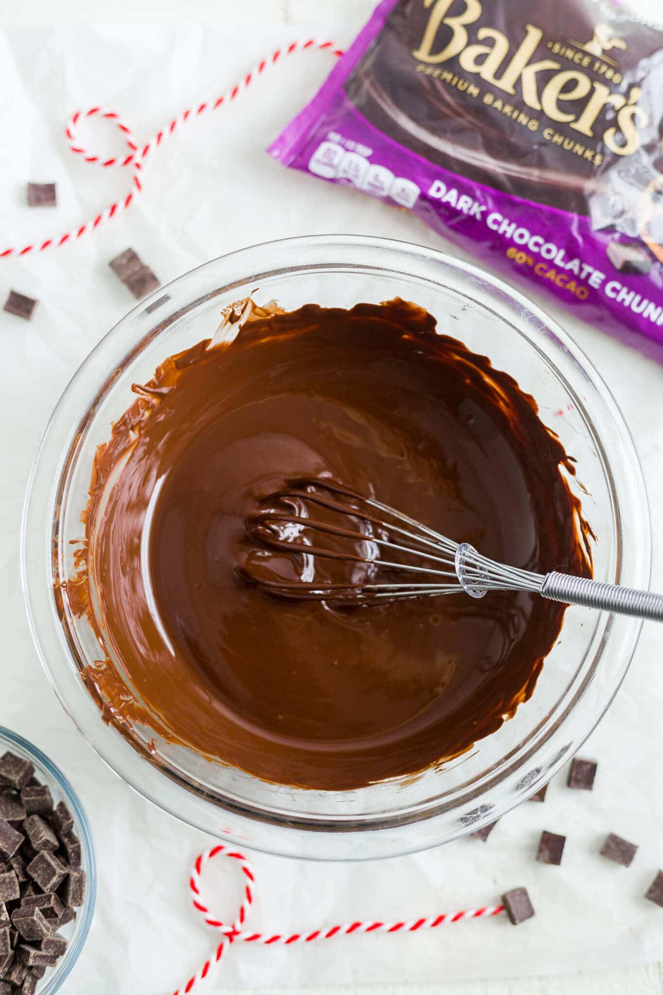 melted chocolate in a bowl with a whisk