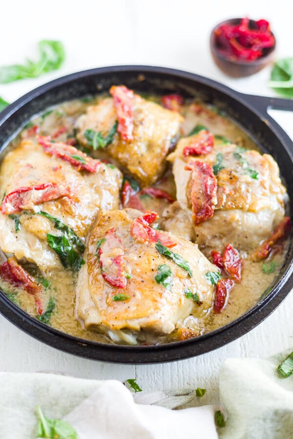 creamy tuscan chicken in a skillet