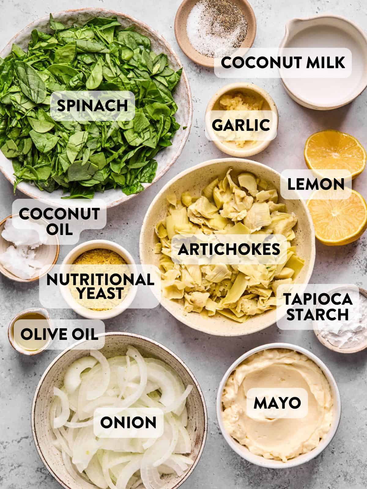 ingredients for dairy free spinach artichoke dip on a counter.