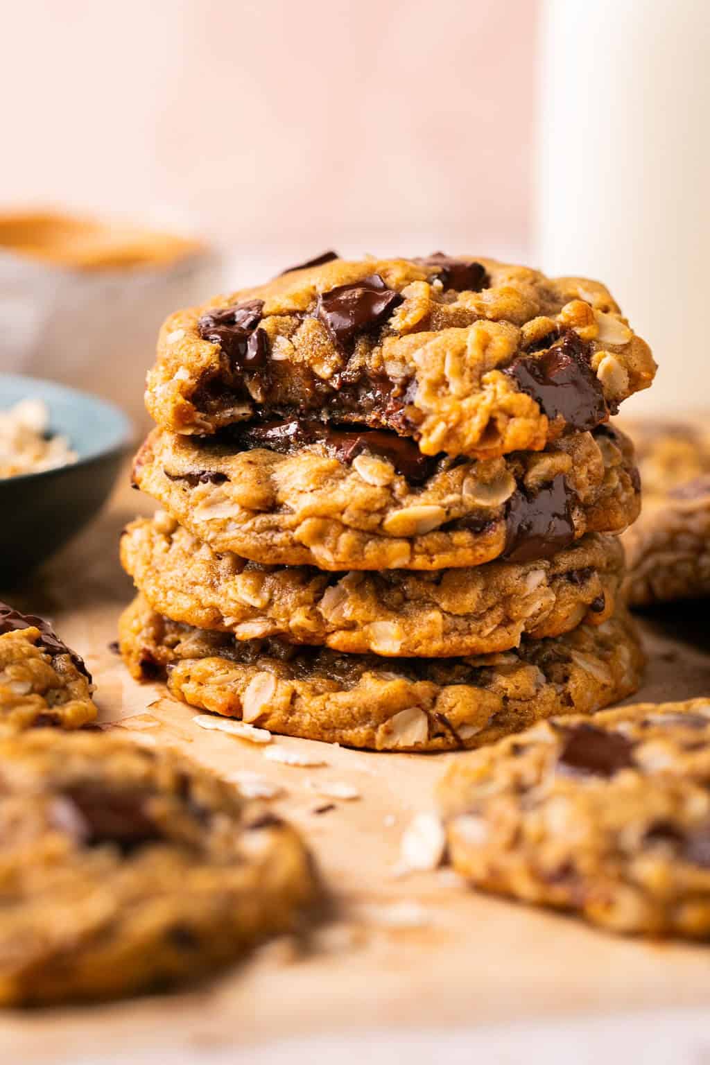 a stack of flourless oatmeal cookies with a bite taken out of the top one.