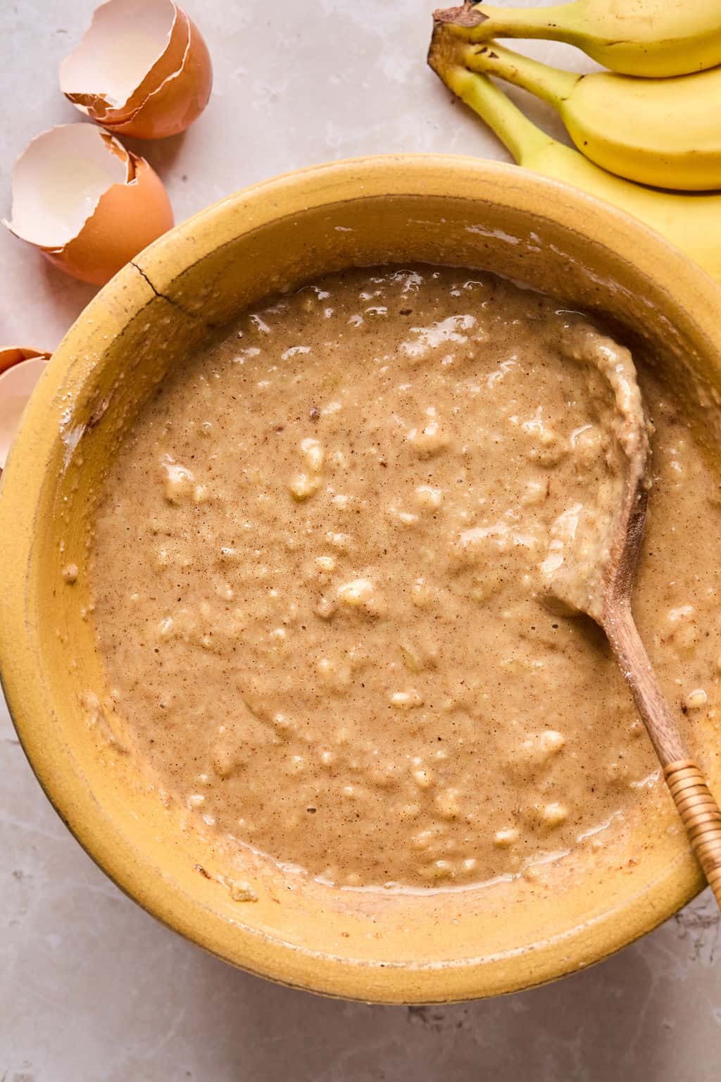 paleo banana bread batter in a mixing bowl.