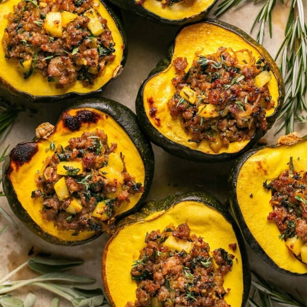 sausage stuffed acorn squash on a tray