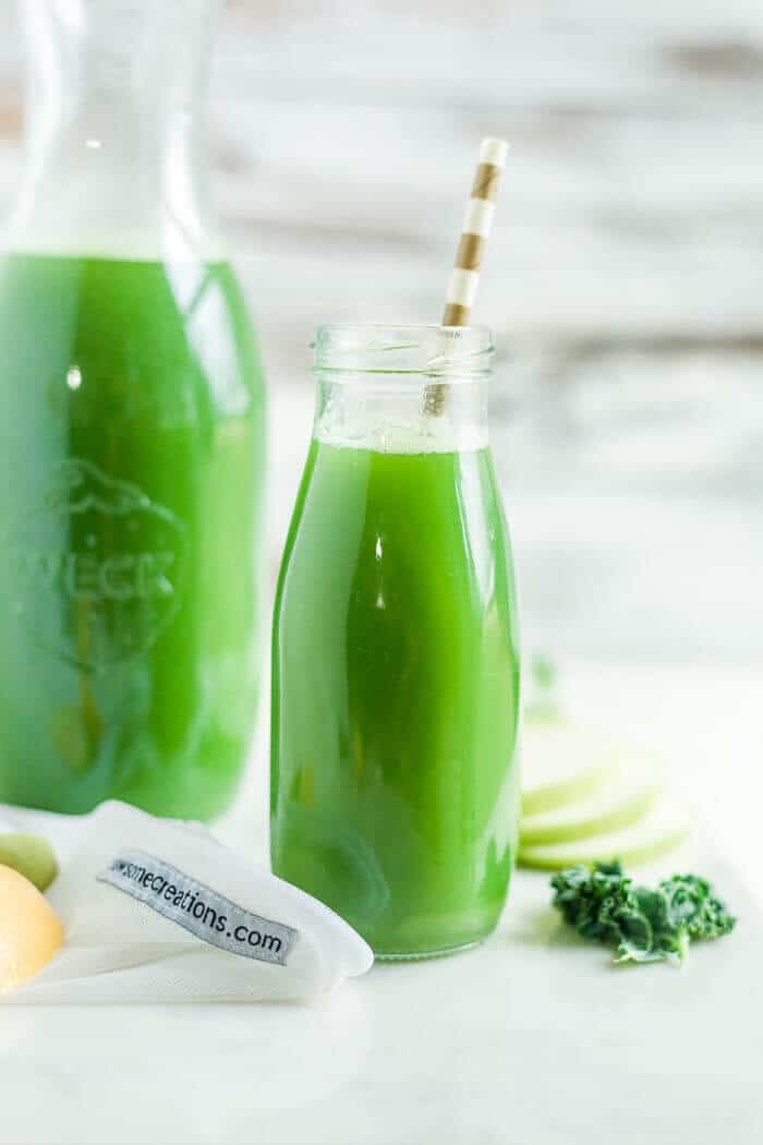 green juice recipe in a glass bottle with a paper straw