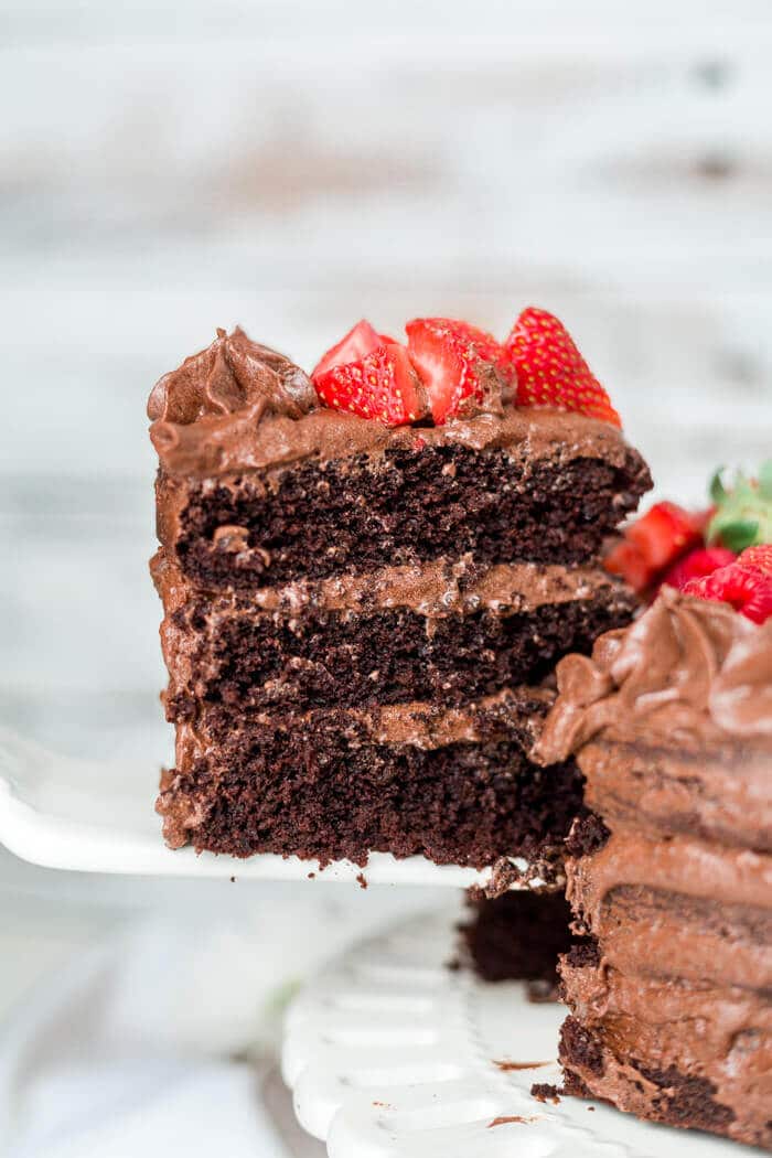 thick layers of paleo chocolate cake coated in a paleo buttercream