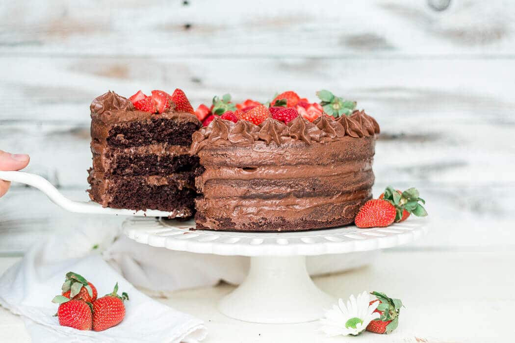 a slice of paleo chocolate cake being pulled out to serve