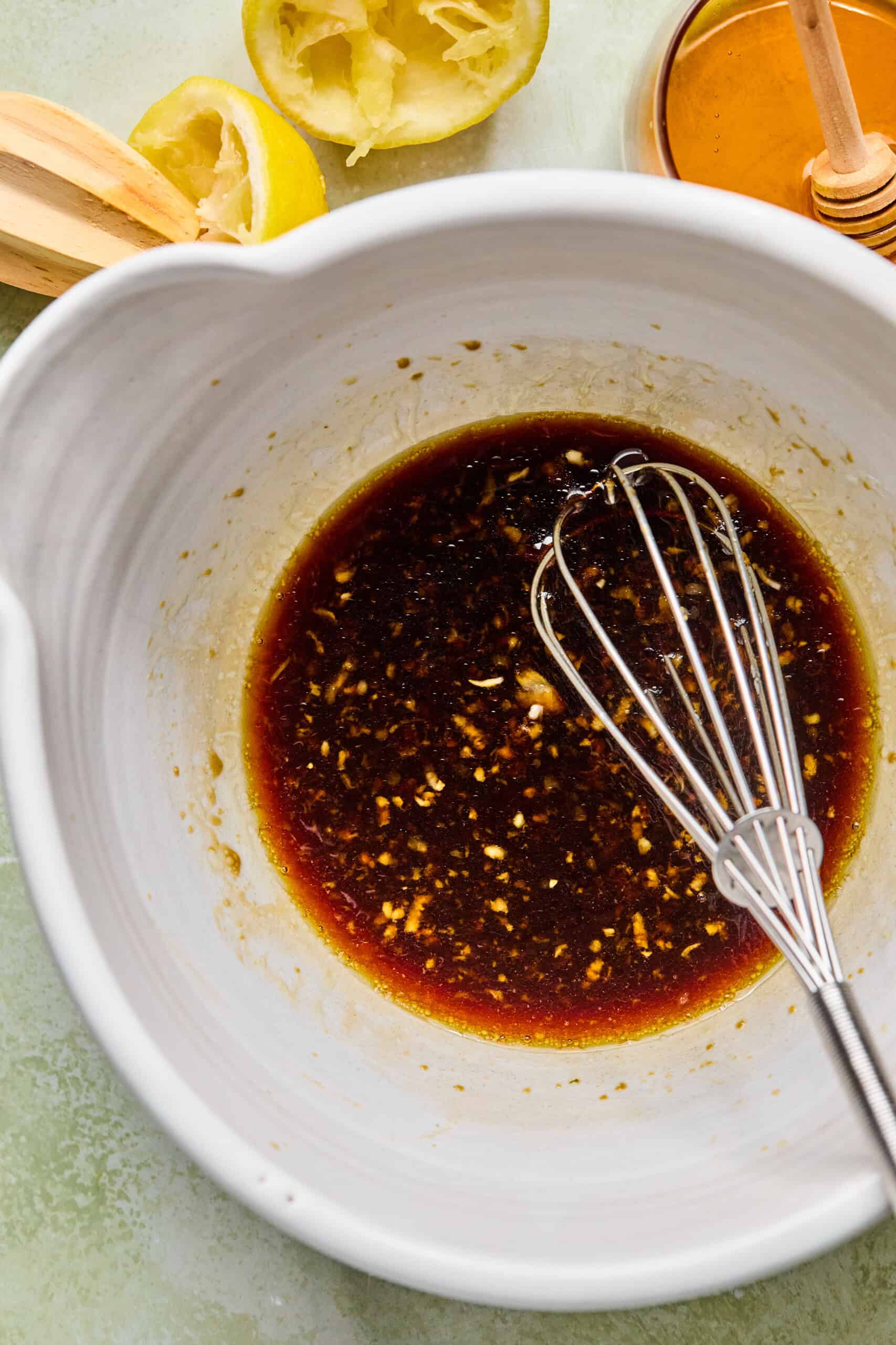 honey garlic asian marinade whisked in a white bowl.