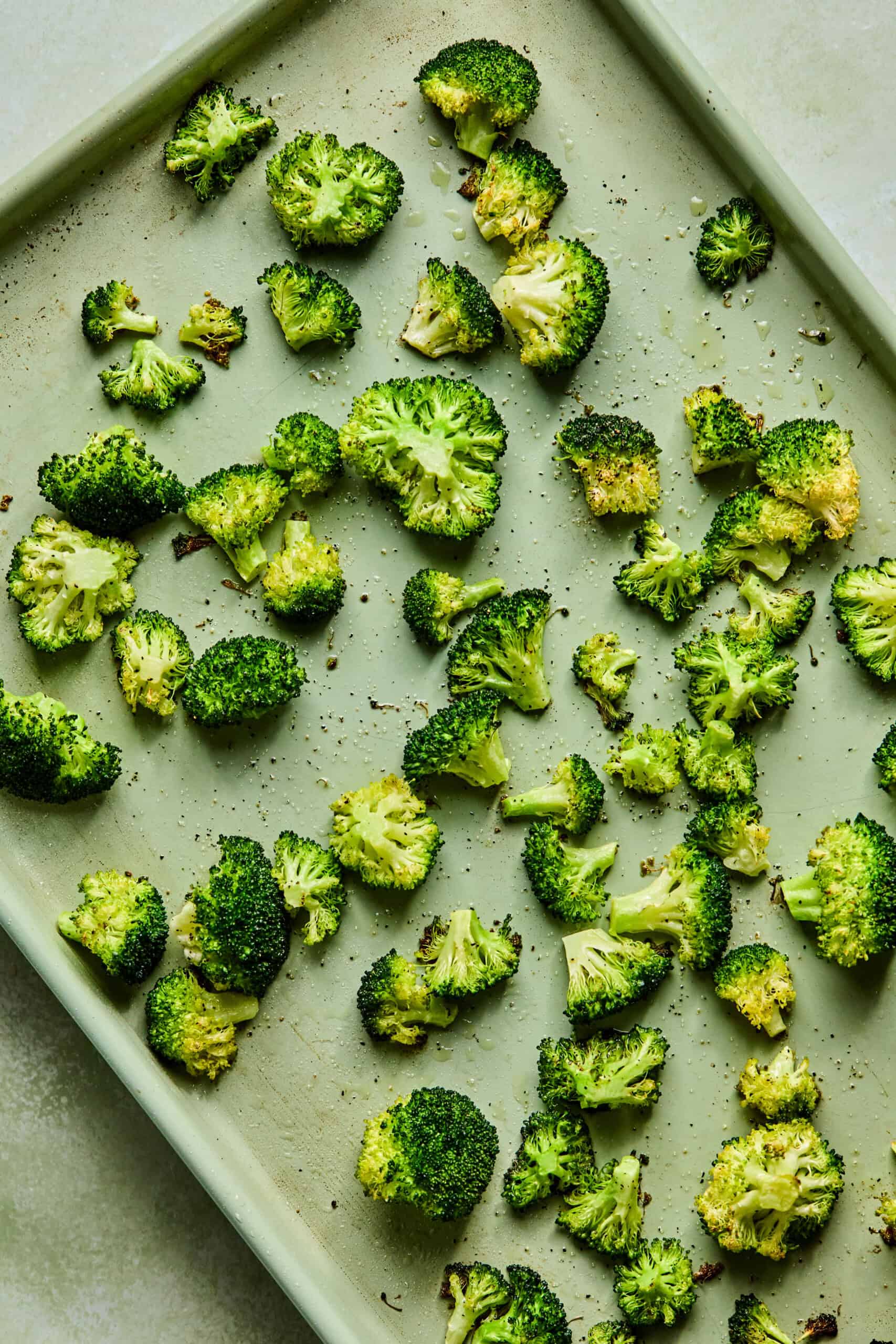 roasted broccoli florets on a sheet pan.