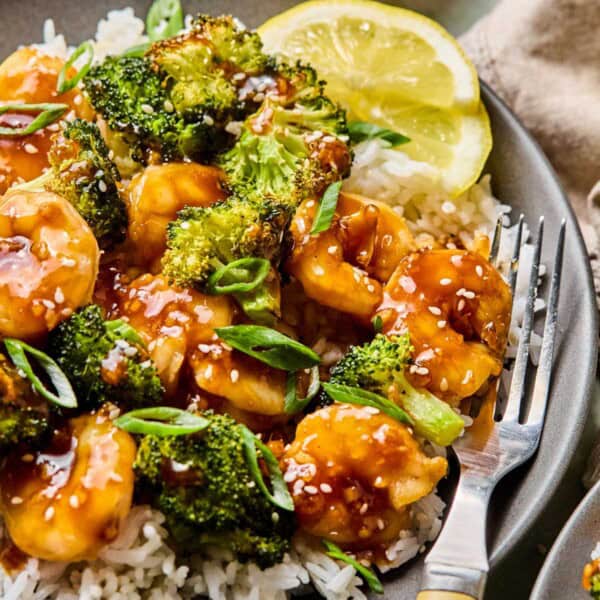 honey garlic shrimp and broccoli in a bowl with white rice.