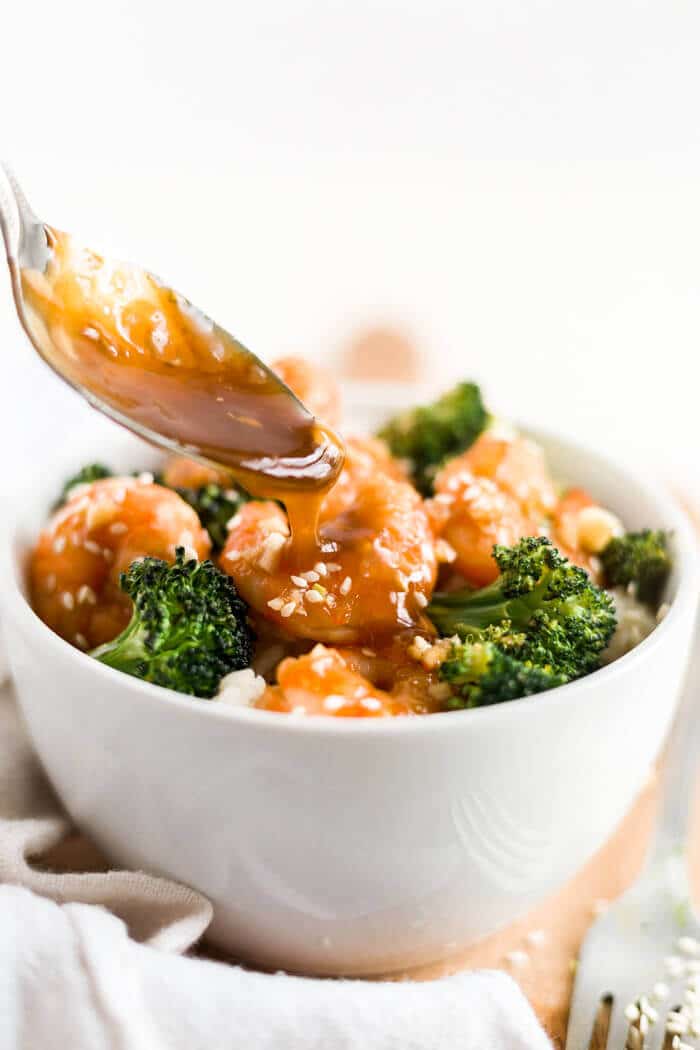 honey garlic shrimp in a bowl with rice and broccoli