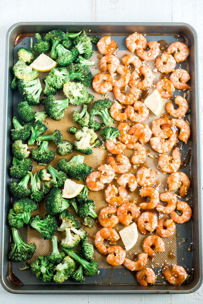 sheet pan with honey garlic shrimp, broccoli and lemon slices