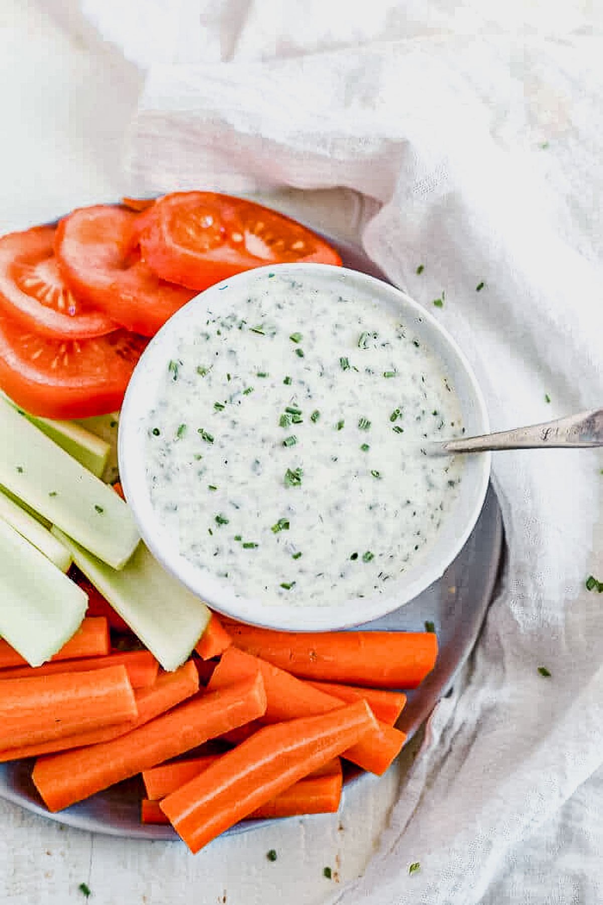 whole30 ranch in a white dish served next to fresh veggies