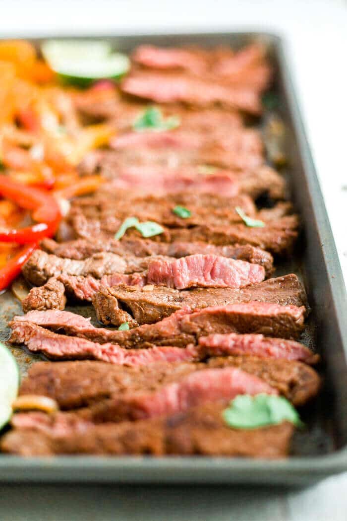 steak fajitas on a sheet pan