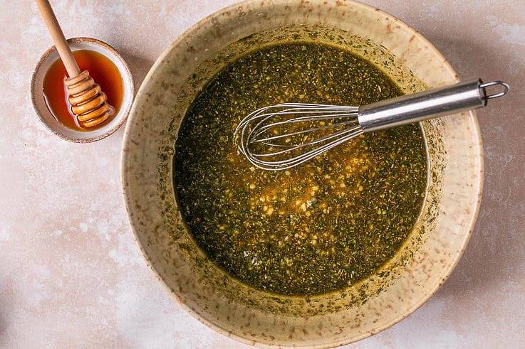 greek seasoning and olive oil mixed in a bowl