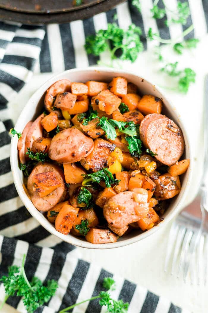 sweet potato hash recipe in a bowl with a striped towell