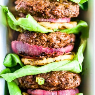 three hawaiian teriyaki burgers stacked with lettuce